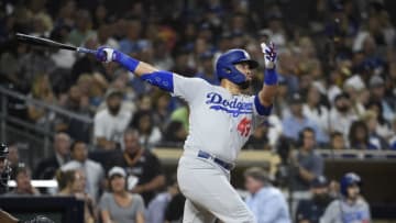 SAN DIEGO, CA - SEPTEMBER 25: Edwin Rios #43 of the Los Angeles Dodgers hits a solo home run during the the seventh inning of a baseball game against the San Diego Padres at Petco Park September 25, 2019 in San Diego, California. (Photo by Denis Poroy/Getty Images)