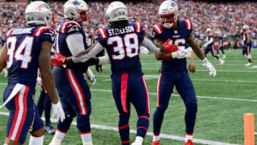 FOXBOROUGH, MASSACHUSETTS - NOVEMBER 06: Rhamondre Stevenson #38 of the New England Patriots celebrates with teammates after scoring a touchdown in the second quarter at Gillette Stadium on November 06, 2022 in Foxborough, Massachusetts. (Photo by Billie Weiss/Getty Images)