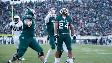 EAST LANSING, MI - NOVEMBER 28: Gerald Holmes #24 of the Michigan State Spartans reacts after running for a six-yard touchdown against the Penn State Nittany Lions in the second quarter of the game at Spartan Stadium on November 28, 2015 in East Lansing, Michigan. (Photo by Joe Robbins/Getty Images)