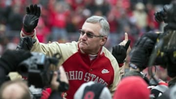 November 24, 2012; Columbus, OH, USA; Ohio State Buckeyes former coach Jim Tressel is held by players from his 2002 National Championship team in a game against the Michigan Wolverines at Ohio Stadium. Mandatory Credit: Greg Bartram-USA TODAY Sports