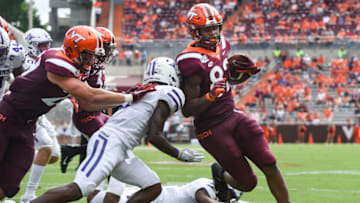 BLACKSBURG, VA - SEPTEMBER 14: Tight end James Mitchell #82 of the Virginia Tech Hokies scores a touchdown against the Furman Paladins in the second half at Lane Stadium on September 14, 2019 in Blacksburg, Virginia. (Photo by Michael Shroyer/Getty Images)