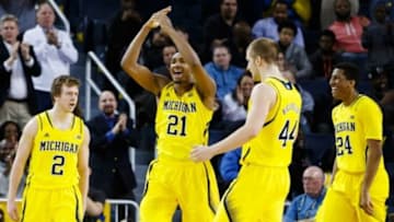 Feb 22, 2015; Ann Arbor, MI, USA; Michigan Wolverines guard Spike Albrecht (2), guard/forward Zak Irvin (21), forward Max Bielfeldt (44) and guard/forward Aubrey Dawkins (24) celebrate in the second half against the Ohio State Buckeyes at Crisler Center. Michigan won 64-57. Mandatory Credit: Rick Osentoski-USA TODAY Sports