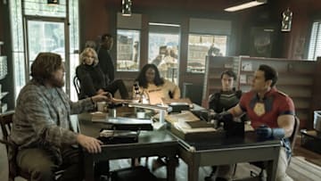 PEACEMAKER. Economos (Steve Agee), Harcourt (Jennifer Holland), Murn (Chukwudi Iwuji), Adebayo (Danielle Brooks), Vigilante (Freddie Stroma), Peacemaker (John Cena). Photograph by Katie Yu/HBO Max.