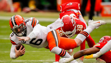KANSAS CITY, MO - JANUARY 17: L'Jarius Sneed #38 of the Kansas City Chiefs tackles Baker Mayfield #6 of the Cleveland Browns for a loss in the first quarter of the AFC Divisional Playoff at Arrowhead Stadium on January 17, 2021 in Kansas City, Missouri. (Photo by David Eulitt/Getty Images)