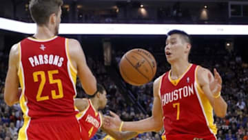 Mar 8, 2013; Oakland, CA, USA; Houston Rockets guard Jeremy Lin (7) and forward Chandler Parsons (25) attempt to rebound the ball against the Golden State Warriors in the third quarter at ORACLE arena. The Rockets defeated the Warriors 94-88. Mandatory Credit: Cary Edmondson-USA TODAY Sports
