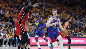 DENVER, COLORADO - JUNE 01: Christian Braun #0 of the Denver Nuggets dribbles against Bam Adebayo #13 of the Miami Heat during the second quarter in Game One of the 2023 NBA Finals at Ball Arena on June 01, 2023 in Denver, Colorado. NOTE TO USER: User expressly acknowledges and agrees that, by downloading and or using this photograph, User is consenting to the terms and conditions of the Getty Images License Agreement. (Photo by Matthew Stockman/Getty Images)