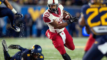 Nov 19, 2016; Morgantown, WV, USA; Oklahoma Sooners running back Joe Mixon (25) runs the ball during the second quarter against the West Virginia Mountaineers at Milan Puskar Stadium. Mandatory Credit: Ben Queen-USA TODAY Sports