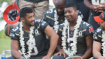 January 29, 2016; Kahuku, HI, USA; Team Irvin quarterback Russell Wilson of the Seattle Seahawks (3, left) talks to Team Irvin quarterback Jameis Winston of the Tampa Bay Buccaneers (3, right) during 2016 Pro Bowl photo day at Turtle Bay Resort. Mandatory Credit: Kyle Terada-USA TODAY Sports