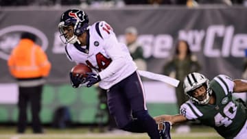EAST RUTHERFORD, NJ - DECEMBER 15: Wide receiver DeAndre Carter #14 of the Houston Texans is tackled by running back Trenton Cannon #40 of the New York Jets during the third quarter at MetLife Stadium on December 15, 2018 in East Rutherford, New Jersey. (Photo by Steven Ryan/Getty Images)