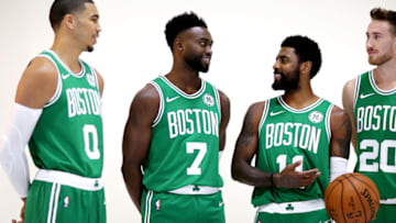 CANTON, MA - SEPTEMBER 24: From left, Jayson Tatum #0, Jaylen Brown #7, Kyrie Irving #11 and Gordon Hayward #20 talk together during a photoshoot on Boston Celtics Media Day on September 24, 2018 in Canton, Massachusetts. NOTE TO USER: User expressly acknowledges and agrees that, by downloading and/or using this photograph, user is consenting to the terms and conditions of the Getty Images License Agreement. (Photo by Maddie Meyer/Getty Images)