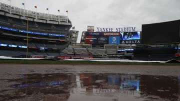NEW YORK, NY - AUGUST 29: Rain puddles up on the warning track as the game between the Cleveland Indians and New York Yankees has been postponed due to rain at Yankee Stadium on August 29, 2017 in the Bronx borough of New York City. (Photo by Rich Schultz/Getty Images)