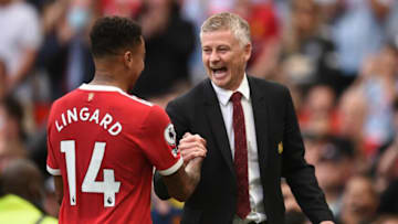 Manchester United's Norwegian manager Ole Gunnar Solskjaer (R) congratulates Manchester United's English midfielder Jesse Lingard (L) after the English Premier League football match between Manchester United and Newcastle at Old Trafford in Manchester, north west England, on September 11, 2021. - Manchester United won the game 4-1. - RESTRICTED TO EDITORIAL USE. No use with unauthorized audio, video, data, fixture lists, club/league logos or 'live' services. Online in-match use limited to 120 images. An additional 40 images may be used in extra time. No video emulation. Social media in-match use limited to 120 images. An additional 40 images may be used in extra time. No use in betting publications, games or single club/league/player publications. (Photo by Oli SCARFF / AFP) / RESTRICTED TO EDITORIAL USE. No use with unauthorized audio, video, data, fixture lists, club/league logos or 'live' services. Online in-match use limited to 120 images. An additional 40 images may be used in extra time. No video emulation. Social media in-match use limited to 120 images. An additional 40 images may be used in extra time. No use in betting publications, games or single club/league/player publications. / RESTRICTED TO EDITORIAL USE. No use with unauthorized audio, video, data, fixture lists, club/league logos or 'live' services. Online in-match use limited to 120 images. An additional 40 images may be used in extra time. No video emulation. Social media in-match use limited to 120 images. An additional 40 images may be used in extra time. No use in betting publications, games or single club/league/player publications. (Photo by OLI SCARFF/AFP via Getty Images)