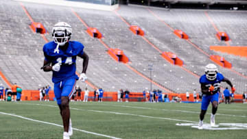 Florida Gators safety Jordan Castell (14) and Florida Gators safety Cahron Rackley (32) participate in a drill during spring football practice at Steve Spurrier Field at Ben Hill Griffin Stadium in Gainesville, FL on Saturday, April 1, 2023. [Matt Pendleton/Gainesville Sun]Ncaa Football Florida Gators Spring Football Practice