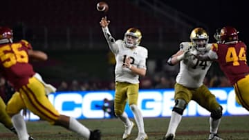 LOS ANGELES, CA - NOVEMBER 24: Quarterback Ian Book #12 of the Notre Dame Fighting Irish throws a pass against the USC Trojans during the second half at Los Angeles Memorial Coliseum on November 24, 2018 in Los Angeles, California. (Photo by Kevork Djansezian/Getty Images)