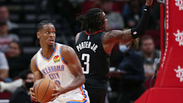 Shai Gilgeous-Alexander #2 of the Oklahoma City Thunder controls the ball ahead of Kevin Porter Jr. #3 of the Houston Rockets during the first half at Toyota Center on November 29, 2021 in Houston, Texas. (Photo by Carmen Mandato/Getty Images)