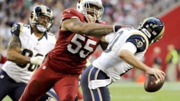 Dec 8, 2013; Phoenix, AZ, USA; St. Louis Rams quarterback Kellen Clemens (10) is tackled by Arizona Cardinals outside linebacker John Abraham (55) during the fourth quarter at University of Phoenix Stadium. The Cardinals defeated the rams 30-10. Mandatory Credit: Casey Sapio-USA TODAY Sports