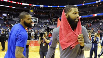 Mar 14, 2016; Washington, DC, USA; Detroit Pistons forward Marcus Morris (13) and Washington Wizards forward Markieff Morris (5) talk after their game at Verizon Center. The Wizards won 124-81. Mandatory Credit: Brad Mills-USA TODAY Sports