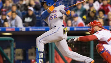 Sep 30, 2016; Philadelphia, PA, USA; New York Mets left fielder Yoenis Cespedes (52) hits a single in front of Philadelphia Phillies catcher Cameron Rupp (29) during the fourth inning at Citizens Bank Park. Mandatory Credit: Bill Streicher-USA TODAY Sports