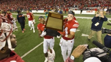 Oct 29, 2016; Madison, WI, USA; Wisconsin Badgers running back Corey Clement (6) and tight end Eric Steffes (44) lift the Freedom Trophy following the game against the Nebraska Cornhuskers at Camp Randall Stadium. Wisconsin won 23-17. Mandatory Credit: Jeff Hanisch-USA TODAY Sports