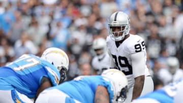 Oct 25, 2015; San Diego, CA, USA; Oakland Raiders outside linebacker Aldon Smith (99) looks across the line during the first quarter against the San Diego Chargers at Qualcomm Stadium. Mandatory Credit: Jake Roth-USA TODAY Sports