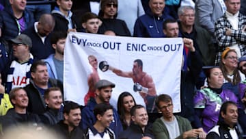 LONDON, ENGLAND - OCTOBER 03: Tottenham Hotspur fans hold a banner protesting against Chairman Daniel Levy and ENIC group during the Premier League match between Tottenham Hotspur and Aston Villa at Tottenham Hotspur Stadium on October 2, 2021 in London, England. (Photo by Marc Atkins/Getty Images)