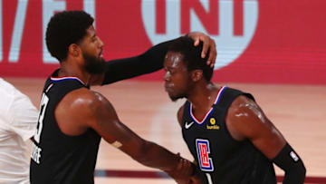 LA Clippers guard Paul George (13) celebrates with guard Reggie Jackson : Kim Klement-USA TODAY Sports