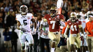 PASADENA, CA - JANUARY 06: Levonte Whitfield #7 of the Florida State Seminoles runs for a 100-yard touchdown on a kickoff return against the Auburn Tigers in the fourth quarter of the 2014 Vizio BCS National Championship Game at the Rose Bowl on January 6, 2014 in Pasadena, California. (Photo by Harry How/Getty Images)