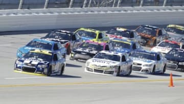 Oct 19, 2014; Talladega, AL, USA; NASCAR Sprint Cup Series driver Jimmie Johnson (48) leads the way early in the Geico 500 at Talladega Superspeedway. Mandatory Credit: Marvin Gentry-USA TODAY Sports