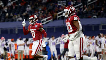 Dec 30, 2020; Arlington, TX, USA; Oklahoma Sooners cornerback Woodi Washington (0) reacts after making an interception during the first half against the Florida Gators at AT&T Stadium. Mandatory Credit: Kevin Jairaj-USA TODAY Sports