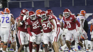 Dec 30, 2020; Arlington, TX, USA; Oklahoma Sooners linebacker Brian Asamoah (24) celebrates with teammates after making an interception during the first half against the Florida Gators at AT&T Stadium. Mandatory Credit: Kevin Jairaj-USA TODAY Sports