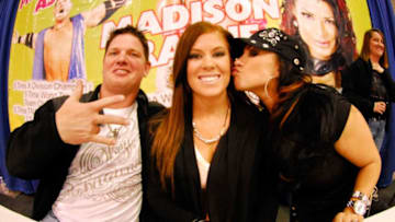 LOUISVILLE, KY - FEBRUARY 25: TNA Wrestlers AJ Styles, Madison Rayne, and Tara attends the 48th Annual Carl Casper's Custom and Louisville auto show at the Kentucky Exposition Center on February 25, 2011 in Louisville, Kentucky. (Photo by Stephen J. Cohen/Getty Images)