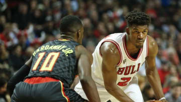 Mar 28, 2016; Chicago, IL, USA; Chicago Bulls guard Jimmy Butler (21) looks to pass the ball against Atlanta Hawks guard Tim Hardaway Jr. (10) during the second half at United Center. Mandatory Credit: Kamil Krzaczynski-USA TODAY Sports