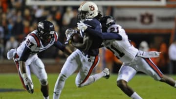 Nov 22, 2014; Auburn, AL, USA; Auburn Tigers wide receiver Sammie Coates (18) catches a pass while defended by Samford Bulldogs defensive back James Bradberry (21) at Jordan Hare Stadium. Mandatory Credit: Shanna Lockwood-USA TODAY Sports
