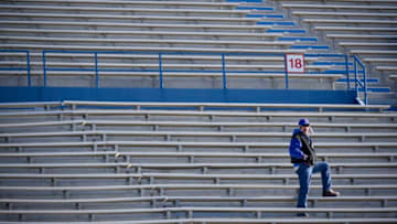 LAWRENCE, KS - NOVEMBER 21: A lone fan watches a game between the West Virginia Mountaineers and Kansas Jayhawks in the first quarter at Memorial Stadium on November 21, 2015 in Lawrence, Kansas. (Photo by Ed Zurga/Getty Images)