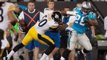 Sep 21, 2014; Charlotte, NC, USA; Carolina Panthers running back Jonathan Stewart (28) gets pushed out of bounds by Pittsburgh Steelers inside linebacker Ryan Shazier (50) during the first quarter at Bank of America Stadium. Mandatory Credit: Jeremy Brevard-USA TODAY Sports