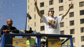 Jun 19, 2015; Oakland, CA, USA; Golden State Warriors guard Klay Thompson raises his arms during the Golden State Warriors 2015 championship celebration in downtown Oakland. Mandatory Credit: Cary Edmondson-USA TODAY Sports