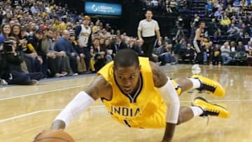 Feb 9, 2015; Indianapolis, IN, USA; Indiana Pacers guard C.J. Watson (32) dives for a loose ball against the San Antonio Spurs at Bankers Life Fieldhouse. Mandatory Credit: Brian Spurlock-USA TODAY Sports