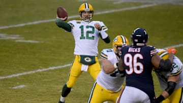 CHICAGO, ILLINOIS - JANUARY 03: Aaron Rodgers #12 of the Green Bay Packers throws a pass against the Chicago Bears during the second quarter in the game at Soldier Field on January 03, 2021 in Chicago, Illinois. (Photo by Quinn Harris/Getty Images)