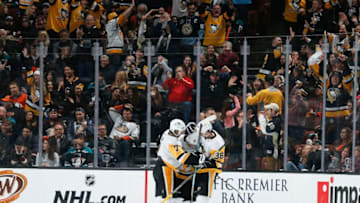ANAHEIM, CA - JANUARY 11: Matt Cullen #7, Phil Kessel #81 and Derek Grant #38 of the Pittsburgh Penguins celebrate Kessel's third-period goal during the game against the Anaheim Ducks at Honda Center on January 11, 2019 in Anaheim, California. (Photo by Debora Robinson/NHLI via Getty Images)