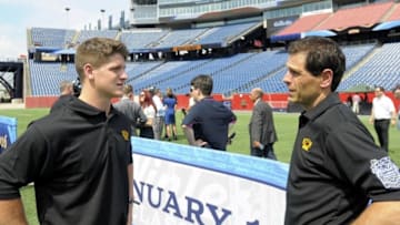 Jul 29, 2015; Foxboro, MA, USA; Boston Bruins defenseman Torey Krug and general manager Don Sweeney chat after a press conference for the Winter Classic hockey game at Gillette Stadium. Mandatory Credit: Bob DeChiara-USA TODAY Sports