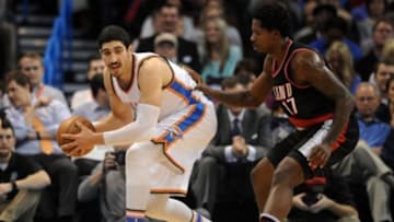 Dec 16, 2015; Oklahoma City, OK, USA; Oklahoma City Thunder center Enes Kanter (11) drives to the basket agains tPortland Trail Blazers center Ed Davis (17) during the second quarter at Chesapeake Energy Arena. Mandatory Credit: Mark D. Smith-USA TODAY Sports