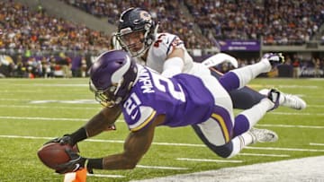 Jan 1, 2017; Minneapolis, MN, USA; Minnesota Vikings running back Jerick McKinnon (21) reaches for the pylon to score a touchdown ahead of the defense of Chicago Bears linebacker Nick Kwiatkoski (44) in the first quarter at U.S. Bank Stadium. Mandatory Credit: Bruce Kluckhohn-USA TODAY Sports
