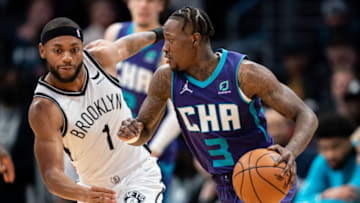 CHARLOTTE, NORTH CAROLINA - MARCH 08: Bruce Brown #1 of the Brooklyn Nets guards Terry Rozier #3 of the Charlotte Hornets during their game at Spectrum Center on March 08, 2022 in Charlotte, North Carolina. NOTE TO USER: User expressly acknowledges and agrees that, by downloading and or using this photograph, User is consenting to the terms and conditions of the Getty Images License Agreement. (Photo by Jacob Kupferman/Getty Images)