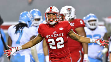 RALEIGH, NC - NOVEMBER 25: Isaiah Stallings #22 of the North Carolina State Wolfpack reacts after their win against the North Carolina Tar Heels at Carter Finley Stadium on November 25, 2017 in Raleigh, North Carolina. North Carolina State won 33-21. (Photo by Grant Halverson/Getty Images)