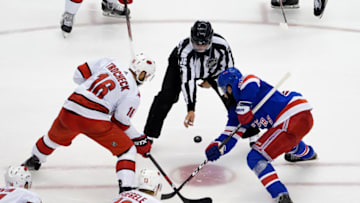 TORONTO, ONTARIO - AUGUST 04: Vincent Trocheck #16 of the Carolina Hurricanes faces off against Mika Zibanejad #93 of the New York Rangers during the third period in Game Three of the Eastern Conference Qualification Round prior to the 2020 NHL Stanley Cup Playoffs at Scotiabank Arena on August 04, 2020 in Toronto, Ontario, Canada. (Photo by Andre Ringuette/Freestyle Photo/Getty Images)