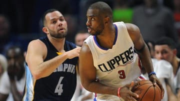 April 12, 2016; Los Angeles, CA, USA; Los Angeles Clippers guard Chris Paul (3) moves the ball against Memphis Grizzlies guard Jordan Farmar (4) during the first half at Staples Center. Mandatory Credit: Gary A. Vasquez-USA TODAY Sports