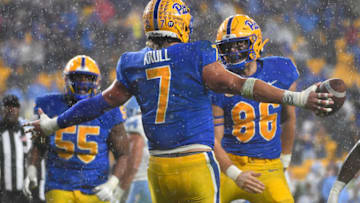 PITTSBURGH, PA - NOVEMBER 11: Lucas Krull #7 of the Pittsburgh Panthers celebrates with Gavin Bartholomew #86 after making a catch for an 11-yard touchdown in overtime against the North Carolina Tar Heels at Heinz Field on November 11, 2021 in Pittsburgh, Pennsylvania. (Photo by Justin Berl/Getty Images)