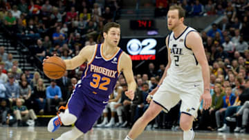 SALT LAKE CITY, UT - MARCH 25: Jimmer Fredette #32 of the Phoenix Suns drives around Joe Ingles #2 of the Utah Jazz during a game at Vivint Smart Home Arena on March 25, 2019 in Salt Lake City, Utah. NOTE TO USER: User expressly acknowledges and agrees that, by downloading and or using this photograph, User is consenting to the terms and conditions of the Getty Images License Agreement. (Photo by Alex Goodlett/Getty Images)
