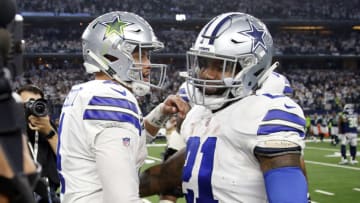 Jan 5, 2019; Arlington, TX, USA; Dallas Cowboys quarterback Dak Prescott (4) and running back Ezekiel Elliott (21) celebrate after winning the game against the Seattle Seahawks in a NFC Wild Card playoff football game at AT&T Stadium. Mandatory Credit: Tim Heitman-USA TODAY Sports