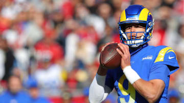 TAMPA, FLORIDA - JANUARY 23: Matthew Stafford #9 of the Los Angeles Rams looks to pass in the fourth quarter against the Tampa Bay Buccaneers in the NFC Divisional Playoff game at Raymond James Stadium on January 23, 2022 in Tampa, Florida. (Photo by Kevin C. Cox/Getty Images)